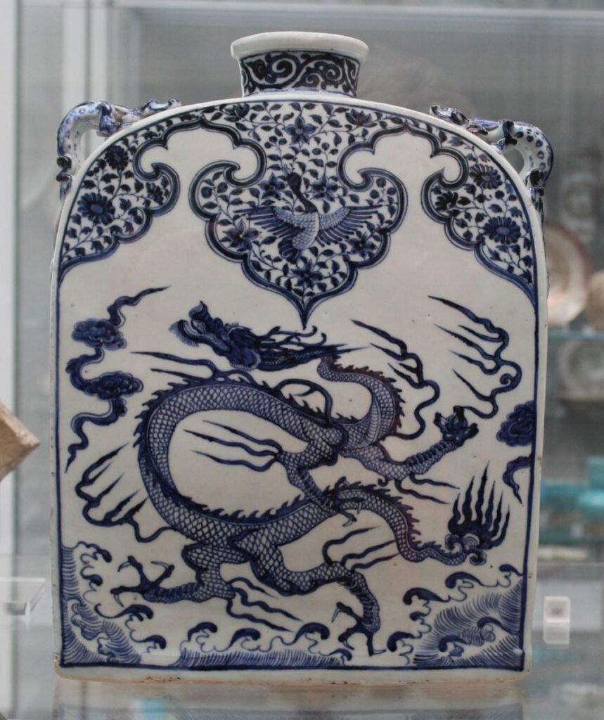 Blue-and-white porcelain flask with dragon motif.